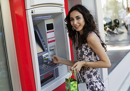 young woman at ATM